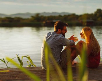 Couple sitting by the River at Tributary Park