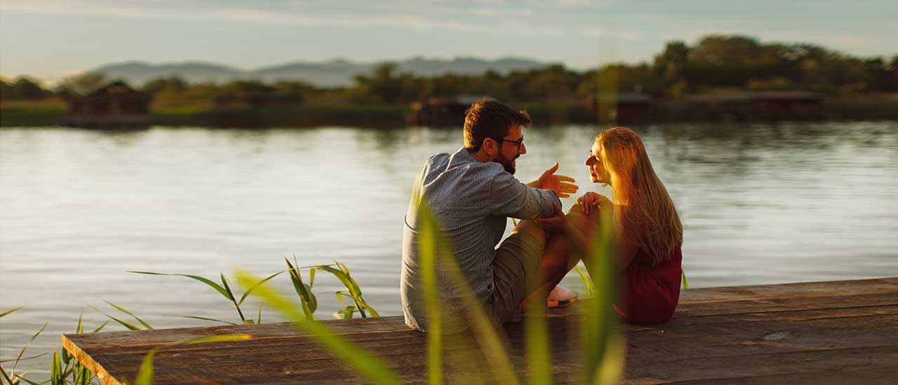 Couple sitting by the River at Tributary Park