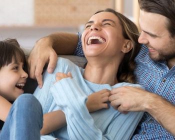 Family on couch at home