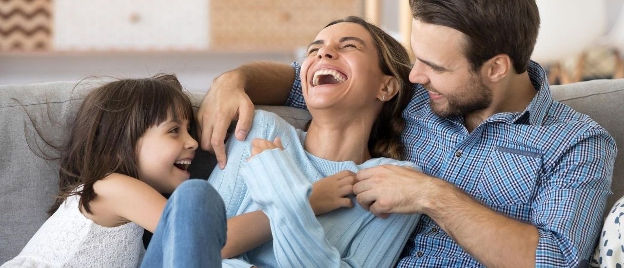Family on couch at home