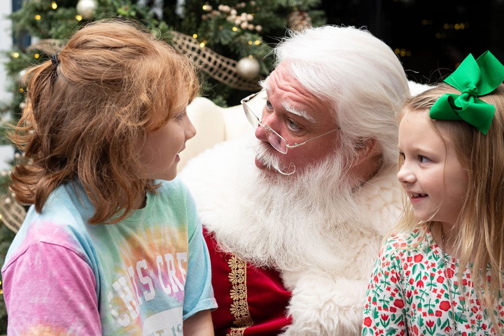 santa claus with sisters at tributary community event