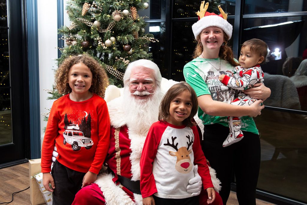 santa claus with family at tributary community event