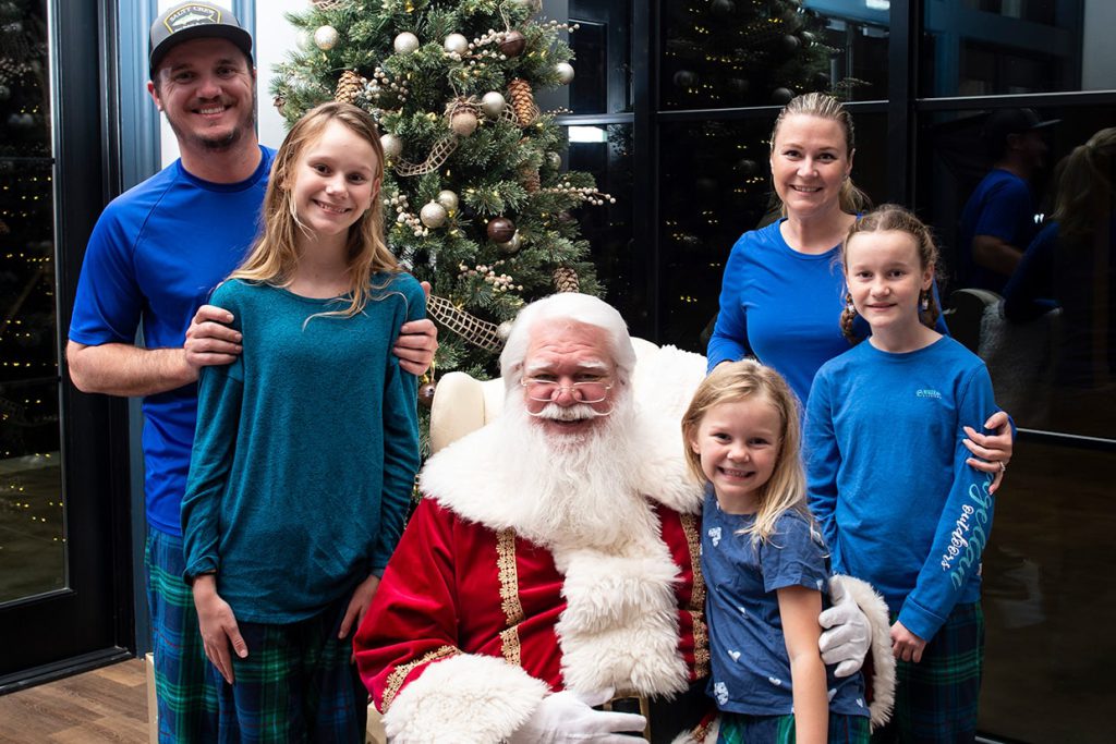 santa claus with family at tributary community event