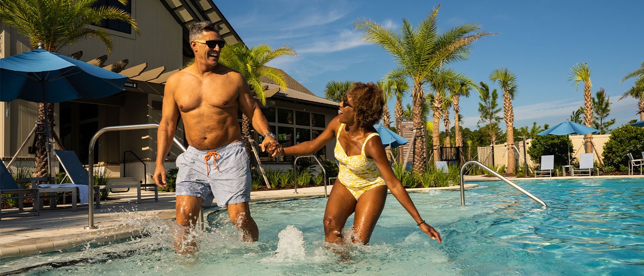 empty nesters splashing in the pool