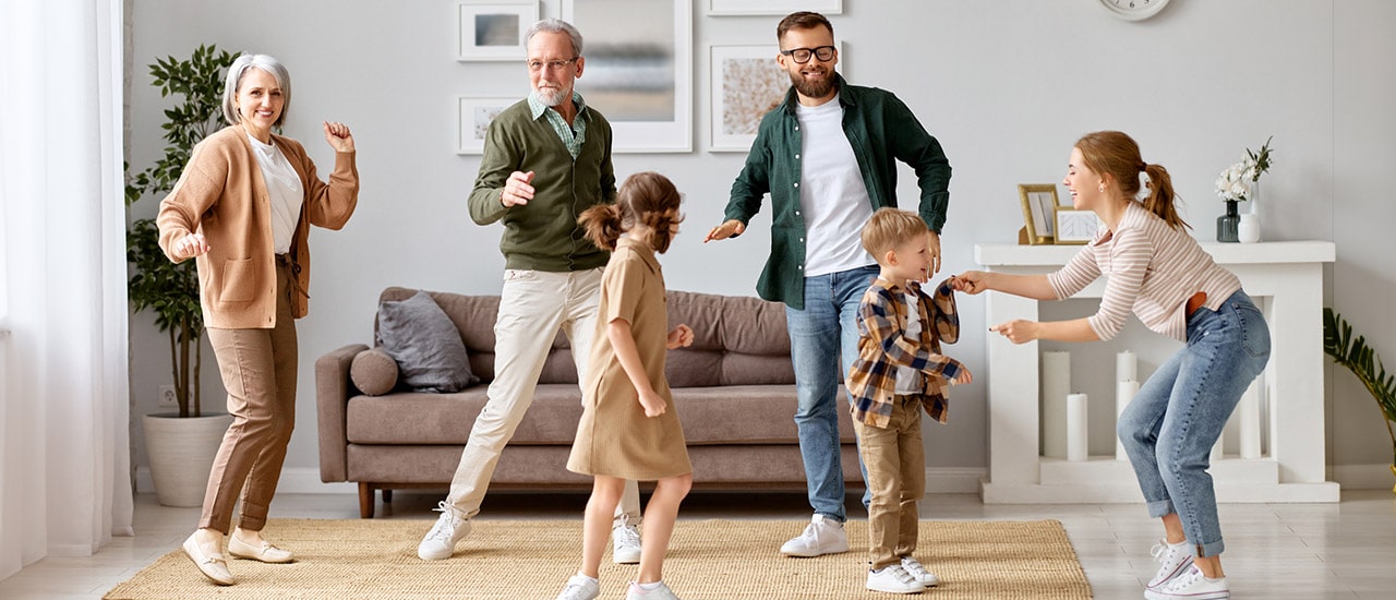 Family dancing in living room