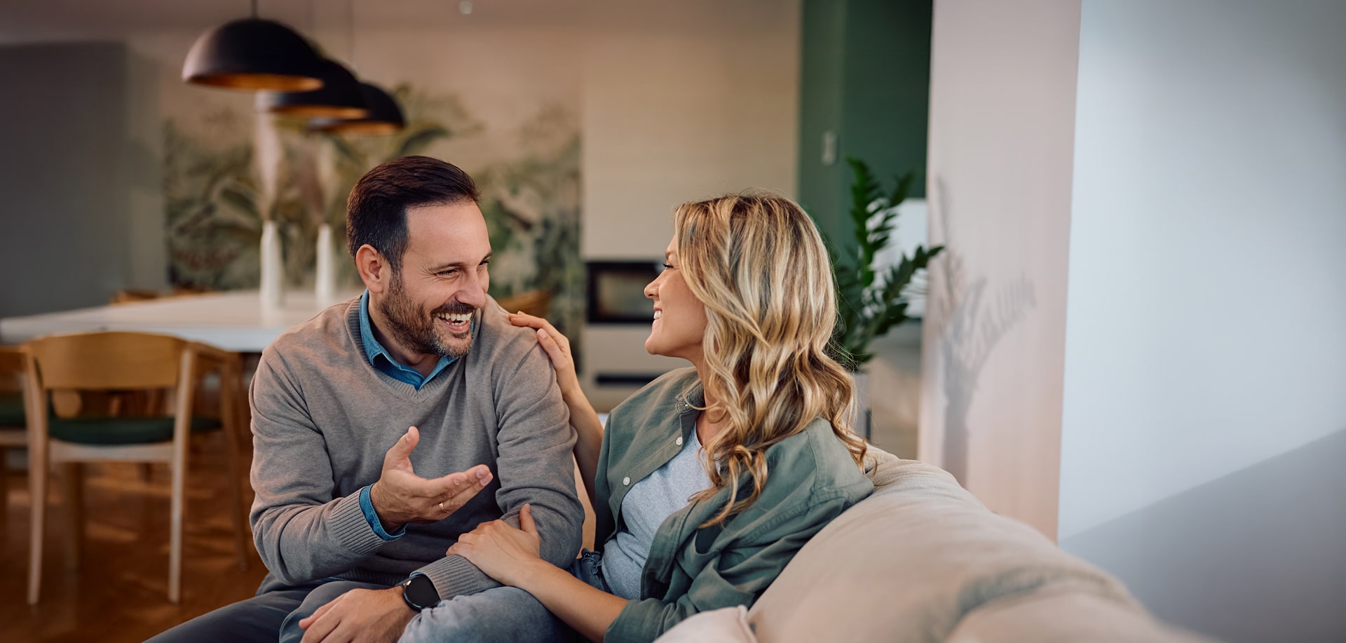 Couple on the couch at Tributary home